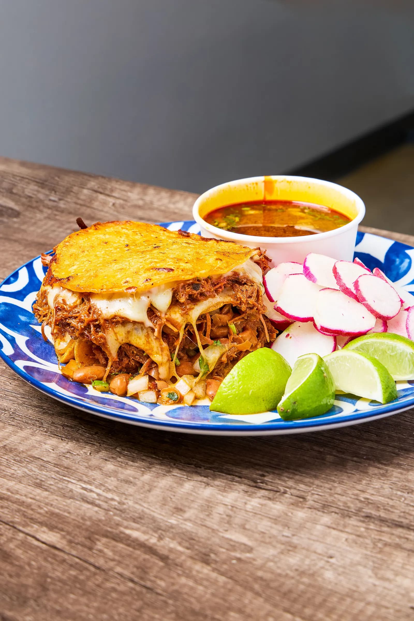 Birria quesatacos with consommé — follow @mr_birria on Instagram