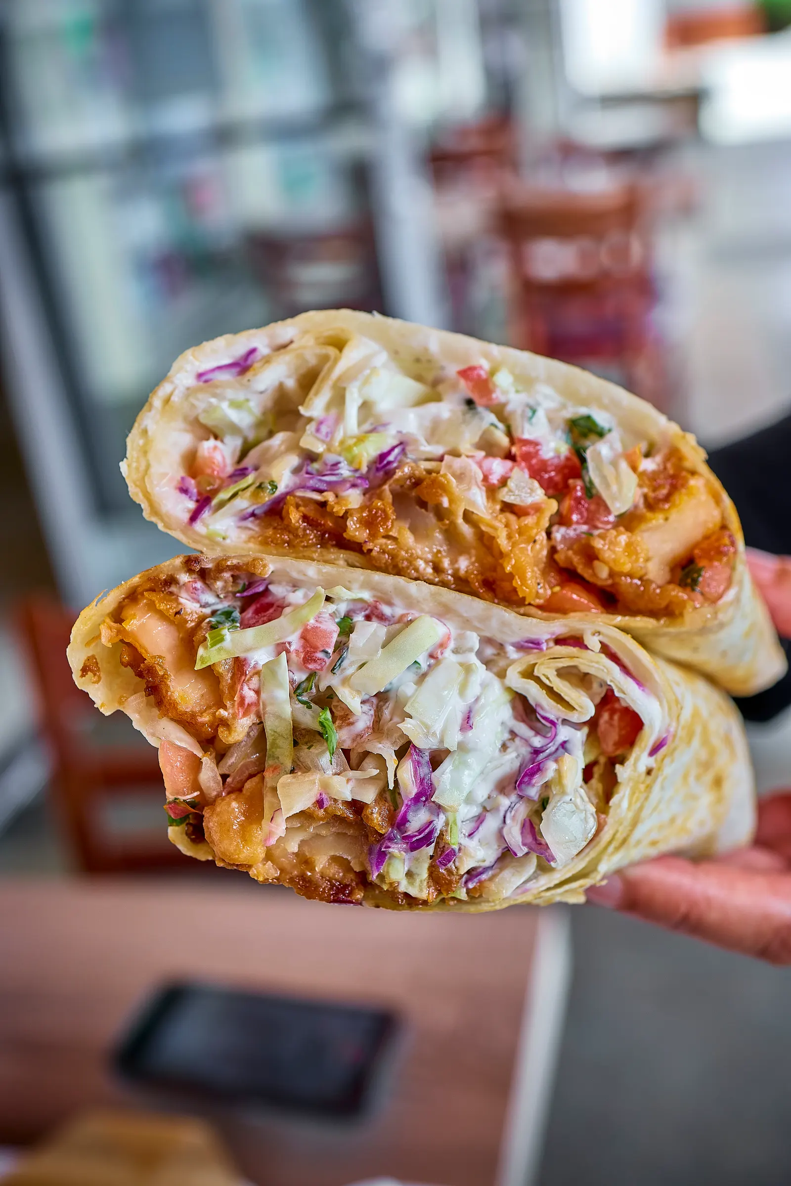 Baja-style beer battered fish burrito cut open at Mr. Birria in Santee