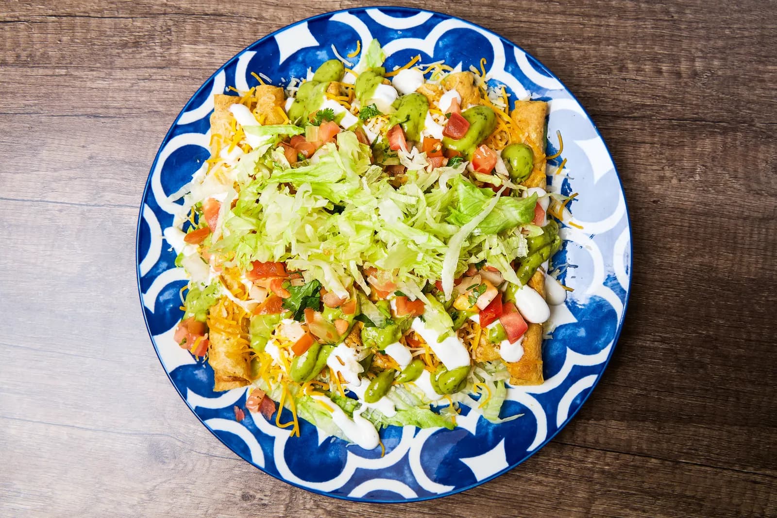Rolled tacos plate with guacamole