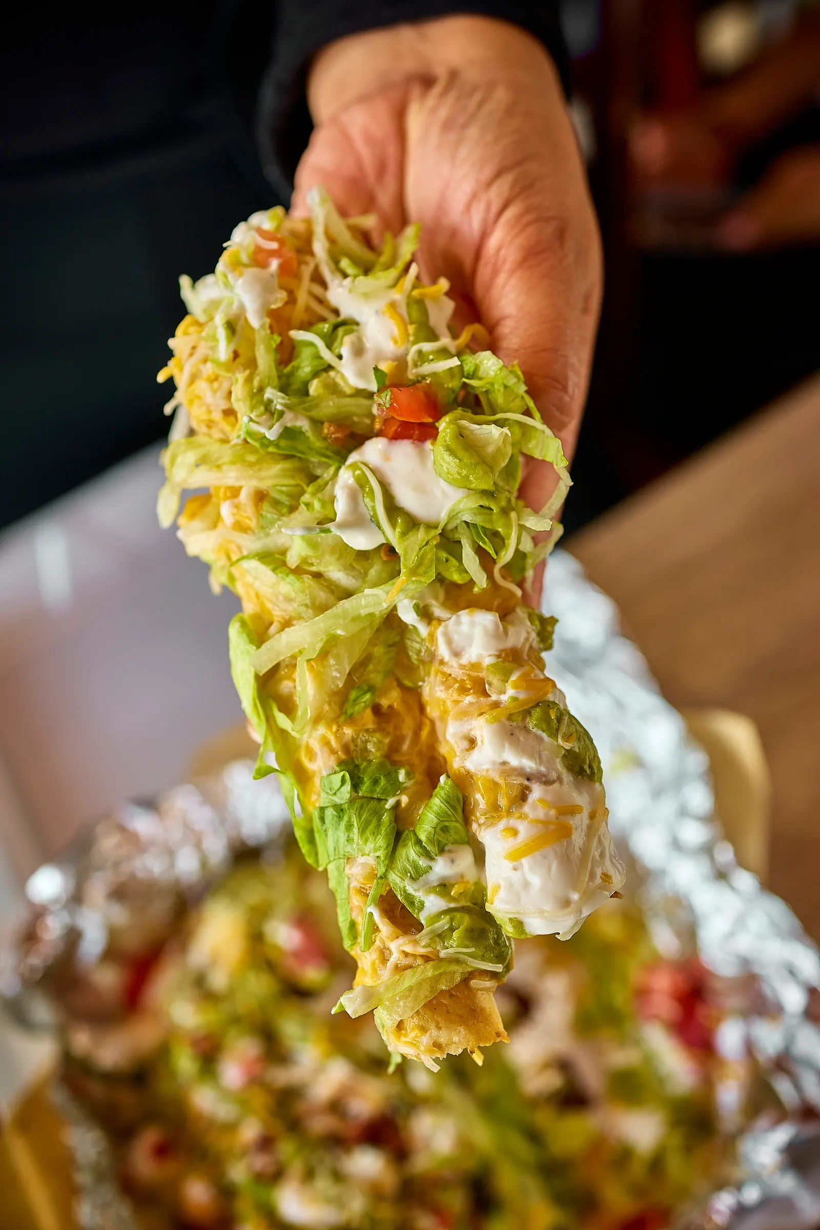 Seven birria rolled tacos with guacamole at Mr. Birria