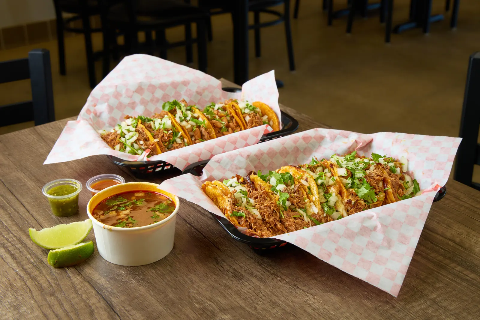 Baskets of birria tacos with consommé at the Mr. Birria restaurant in Santee